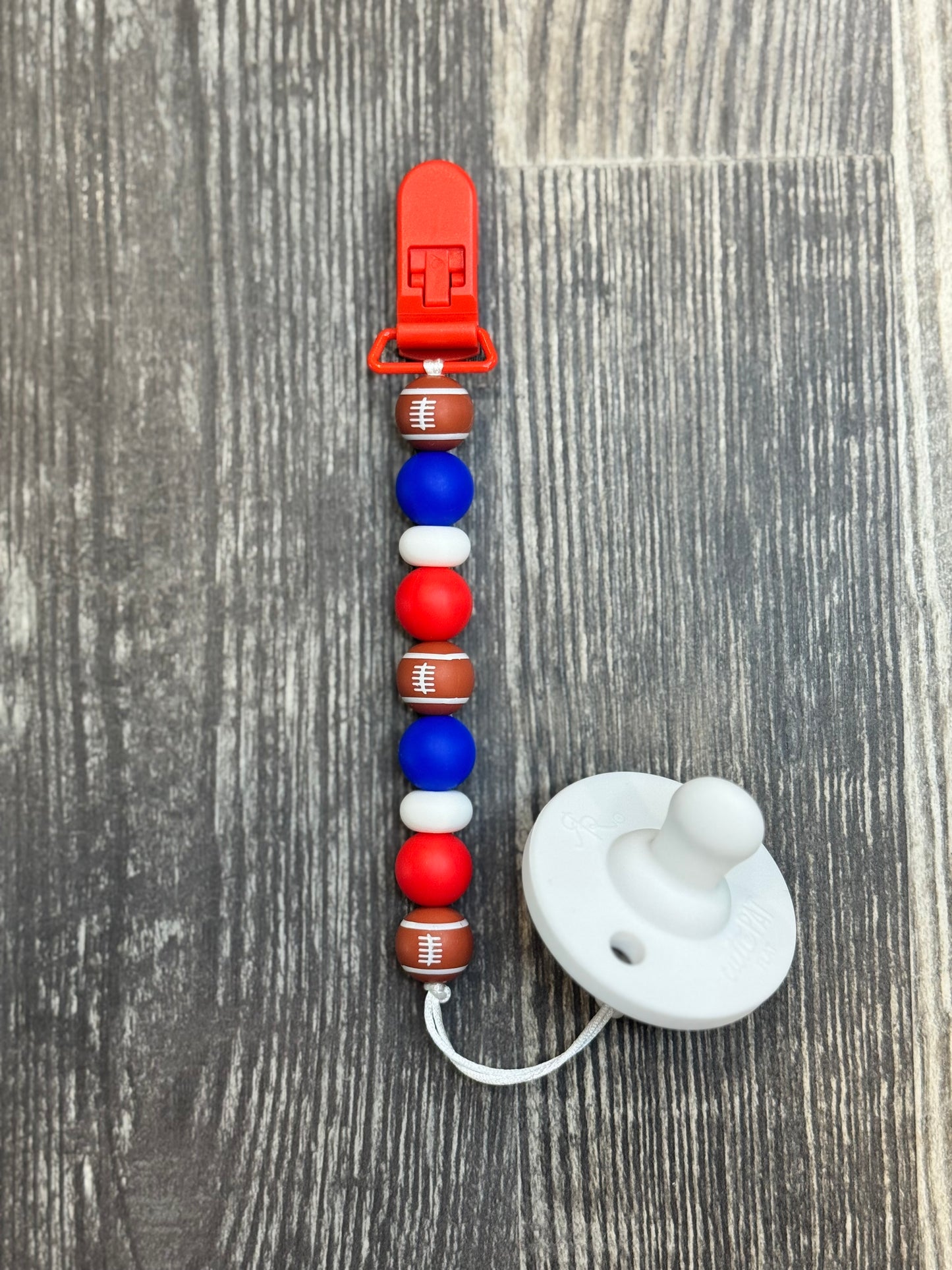 Blue And Red Football Pacifier Clip